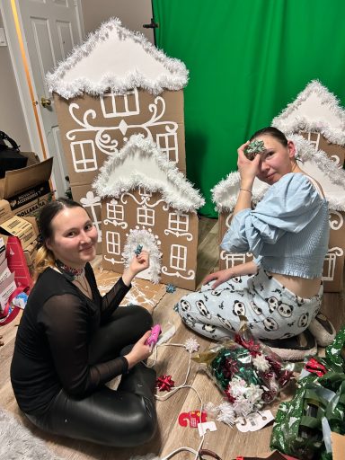 Making Decorations Founder and creative lead Korneliia Khryplyvets creating decorations for the family celebration alongside volunteer Tetyana Rymska.
